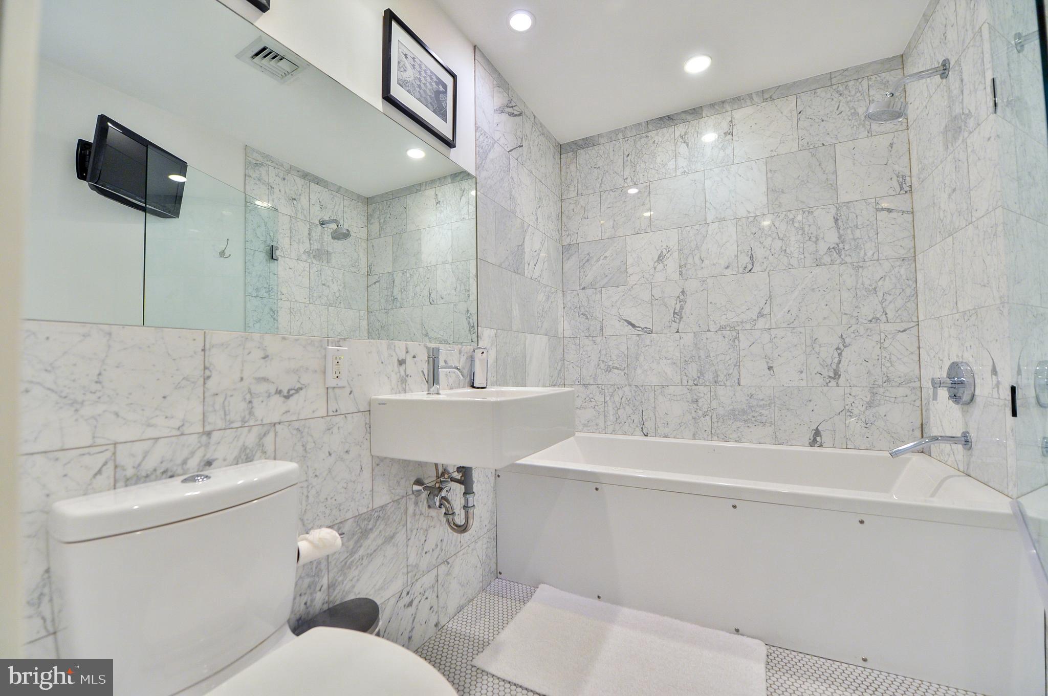 1119 North 3rd Street Philadelphia, PA 19123 - Photo 30 of 46 a bathroom with a sink a toilet and shower