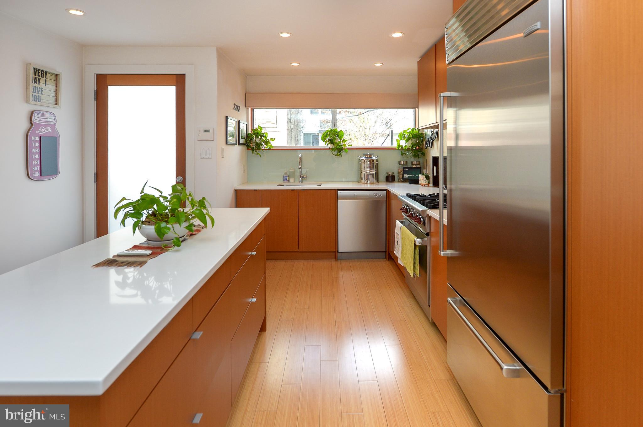1119 North 3rd Street Philadelphia, PA 19123 - Photo 3 of 46 a kitchen with stainless steel appliances granite countertop a refrigerator a sink and a stove