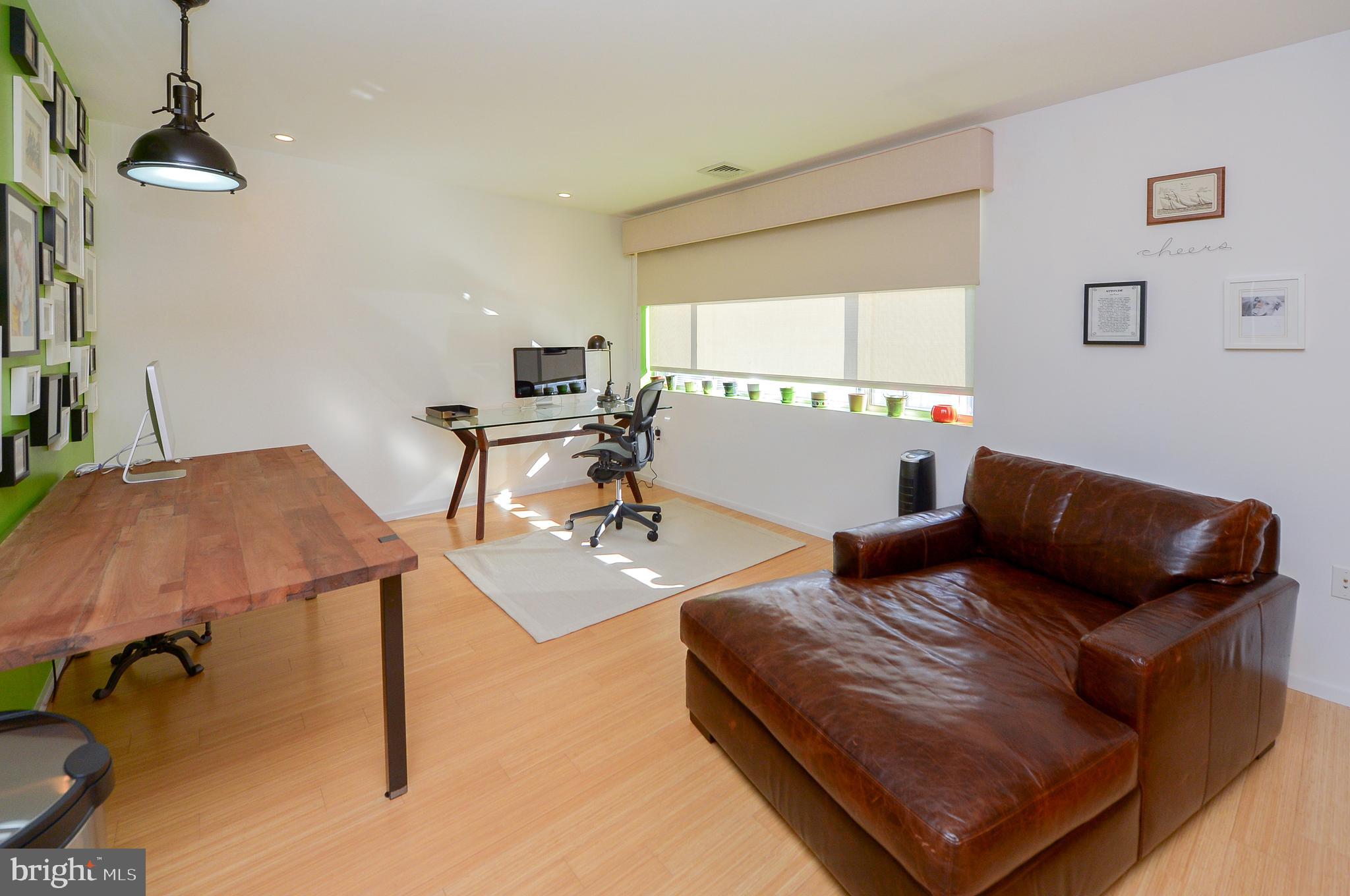 1119 North 3rd Street Philadelphia, PA 19123 - Photo 31 of 46 a living room with furniture and a window