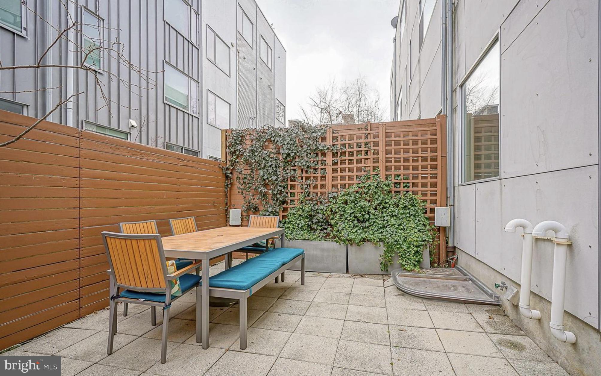 1119 North 3rd Street Philadelphia, PA 19123 - Photo 38 of 46 a balcony with table and chairs