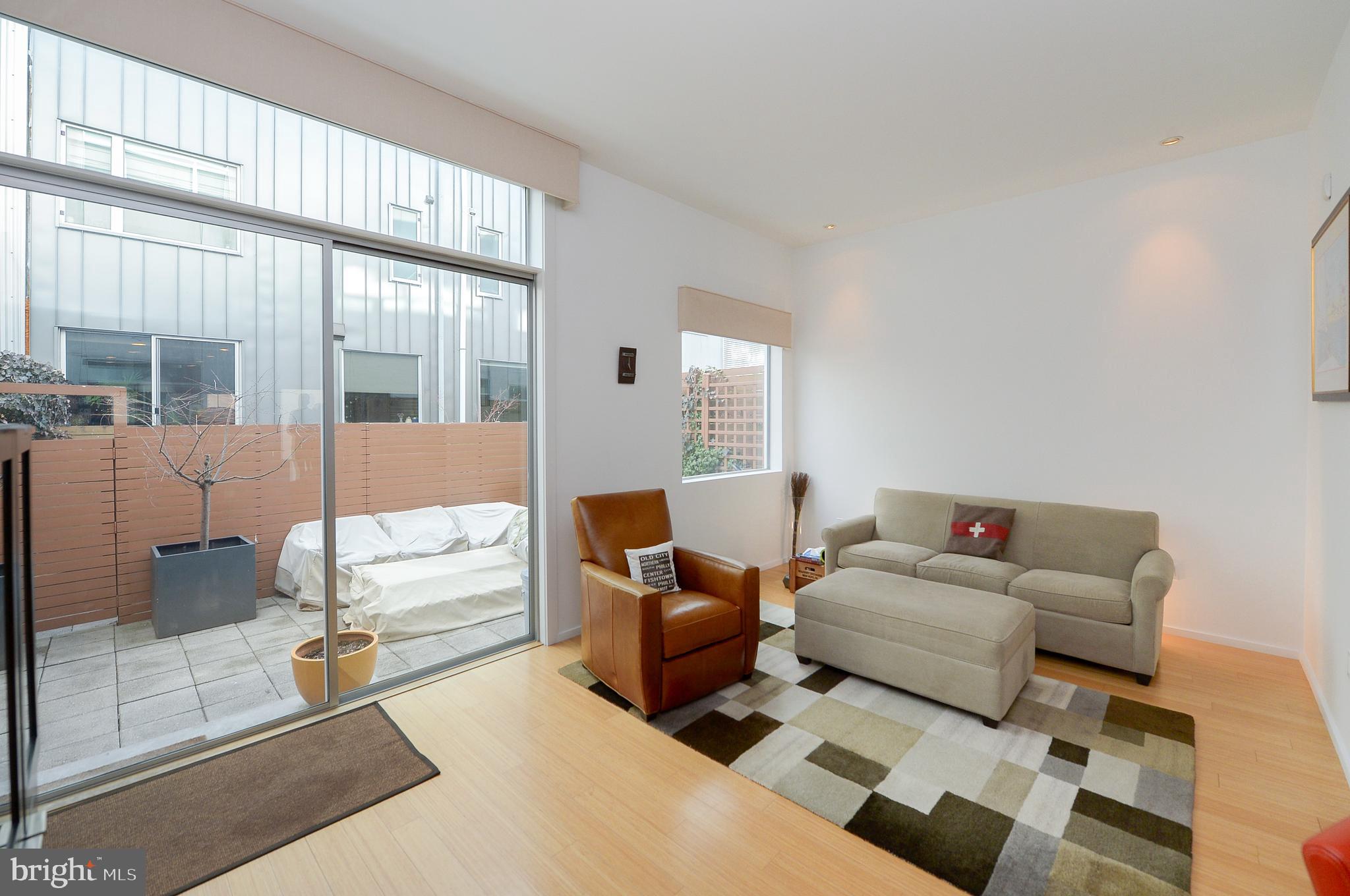 1119 North 3rd Street Philadelphia, PA 19123 - Photo 6 of 46 a bedroom with furniture and a large window