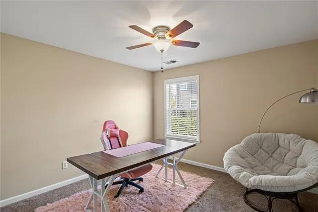 a workspace with furniture and a window