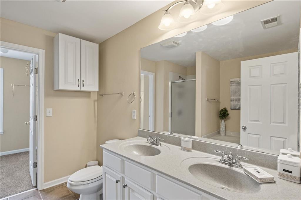 513 Constellation Overlook Southwest Atlanta, GA 30331 - Photo 16 of 32 a bathroom with a sink and a mirror