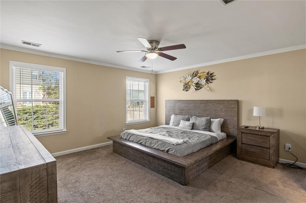 513 Constellation Overlook Southwest Atlanta, GA 30331 - Photo 17 of 32 a bedroom with a bed and a window