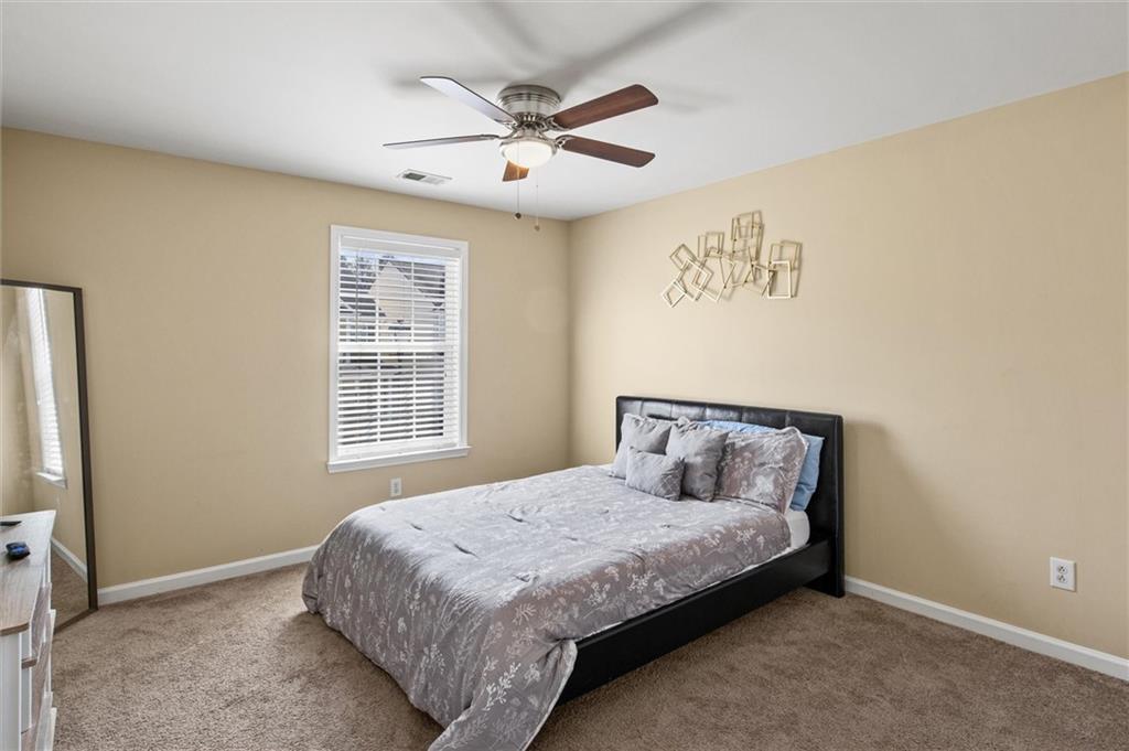 513 Constellation Overlook Southwest Atlanta, GA 30331 - Photo 20 of 32 a bedroom with a bed and window