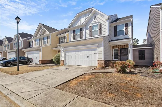 a front view of a house with yard
