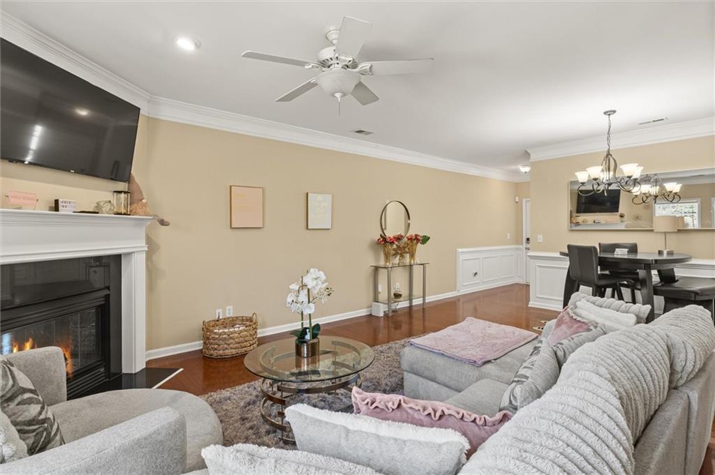 513 Constellation Overlook Southwest Atlanta, GA 30331 - Photo 7 of 32 a living room with furniture a fireplace and a flat screen tv