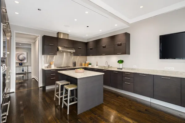a kitchen with a sink and cabinets