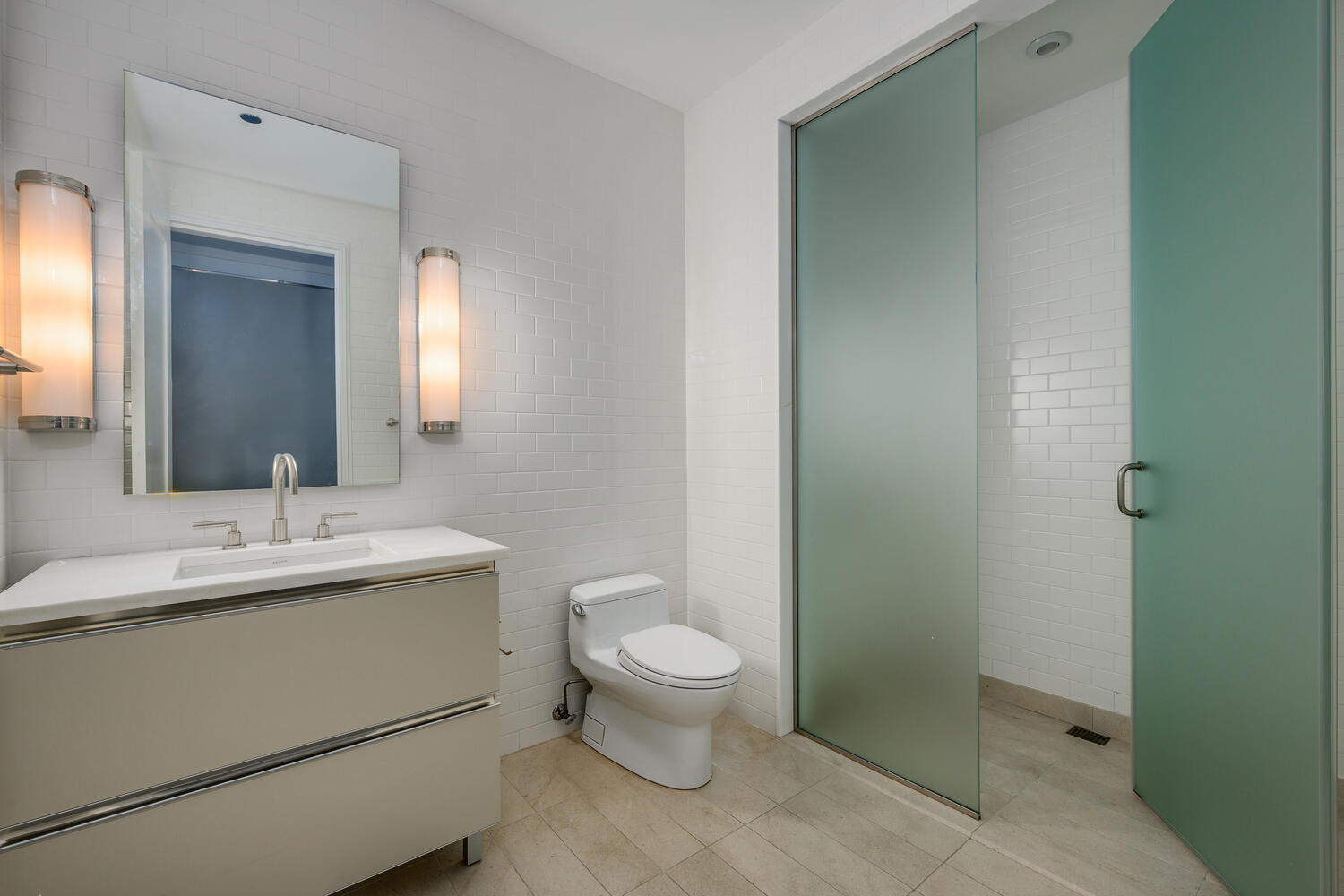77 East Walton Street, Unit 24A Chicago, IL 60611 - Photo 25 of 34 a bathroom with a toilet sink and mirror