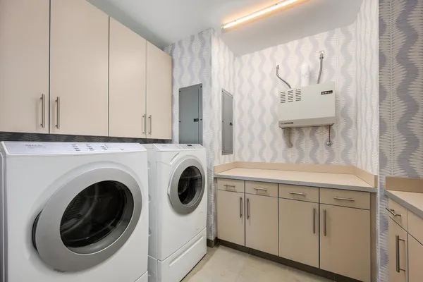 a utility room with cabinets
