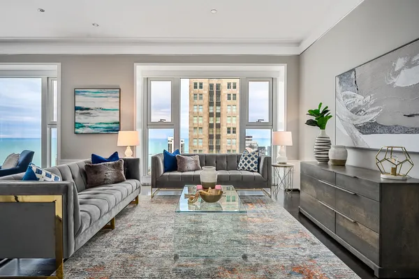 a living room with furniture or couch and a large window