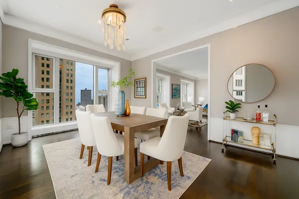 a view of a dining room with furniture and wooden floor