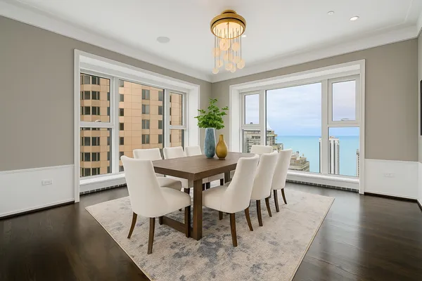 a view of a dining room with furniture window and wooden floor