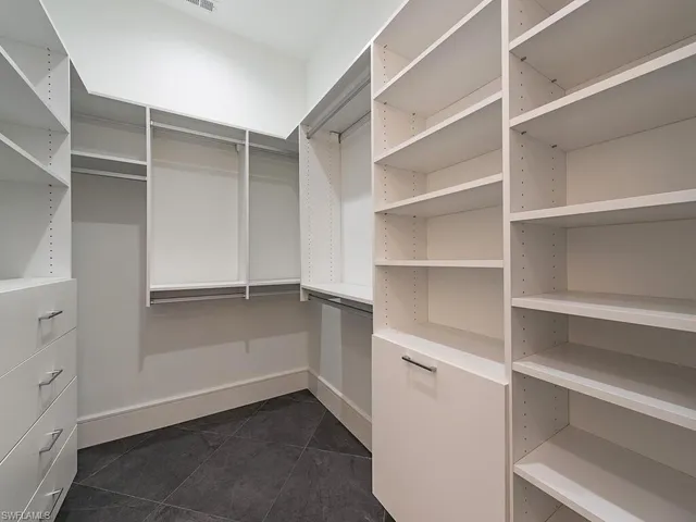 a view of an empty walk in closet