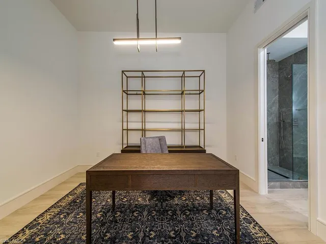 a view of a workspace with furniture