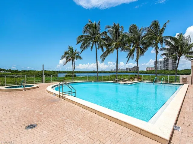 a view of a swimming pool and a yard