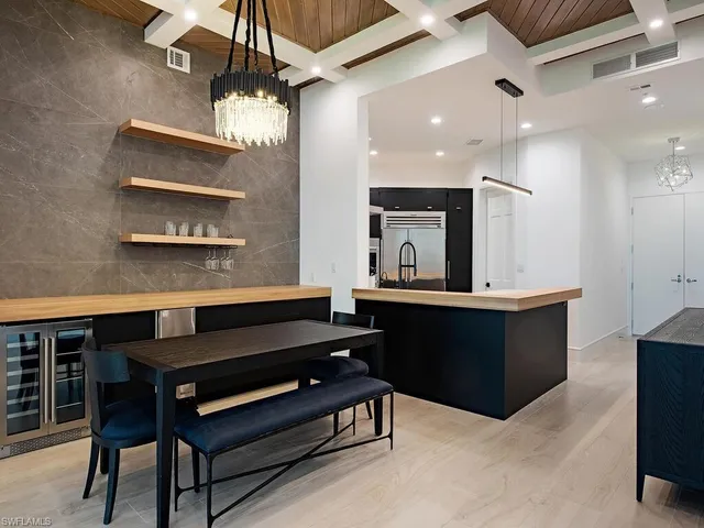 a large kitchen with a table and chairs