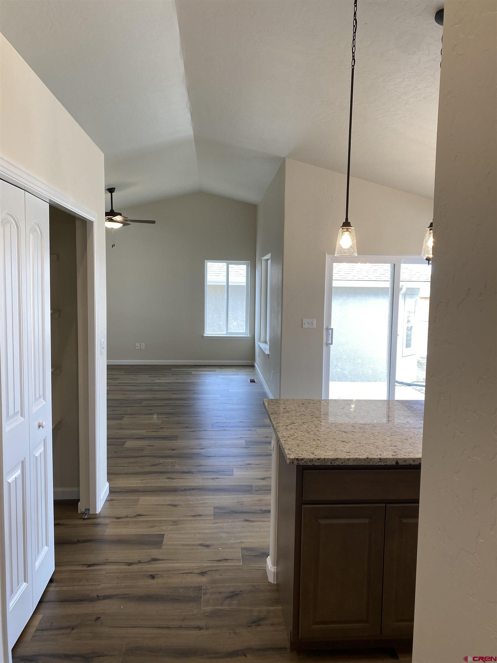3672 Big Pines Loop Montrose, CO 81401 - Photo 15 of 19 a view of kitchen and hall with wooden floor
