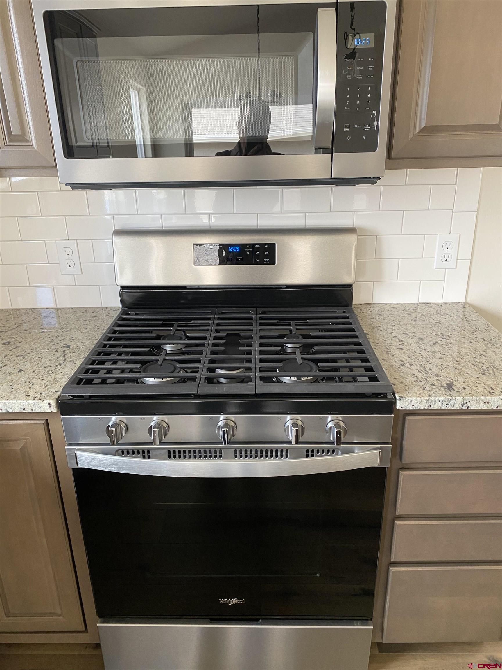 3672 Big Pines Loop Montrose, CO 81401 - Photo 16 of 19 a stove top oven sitting inside of a kitchen