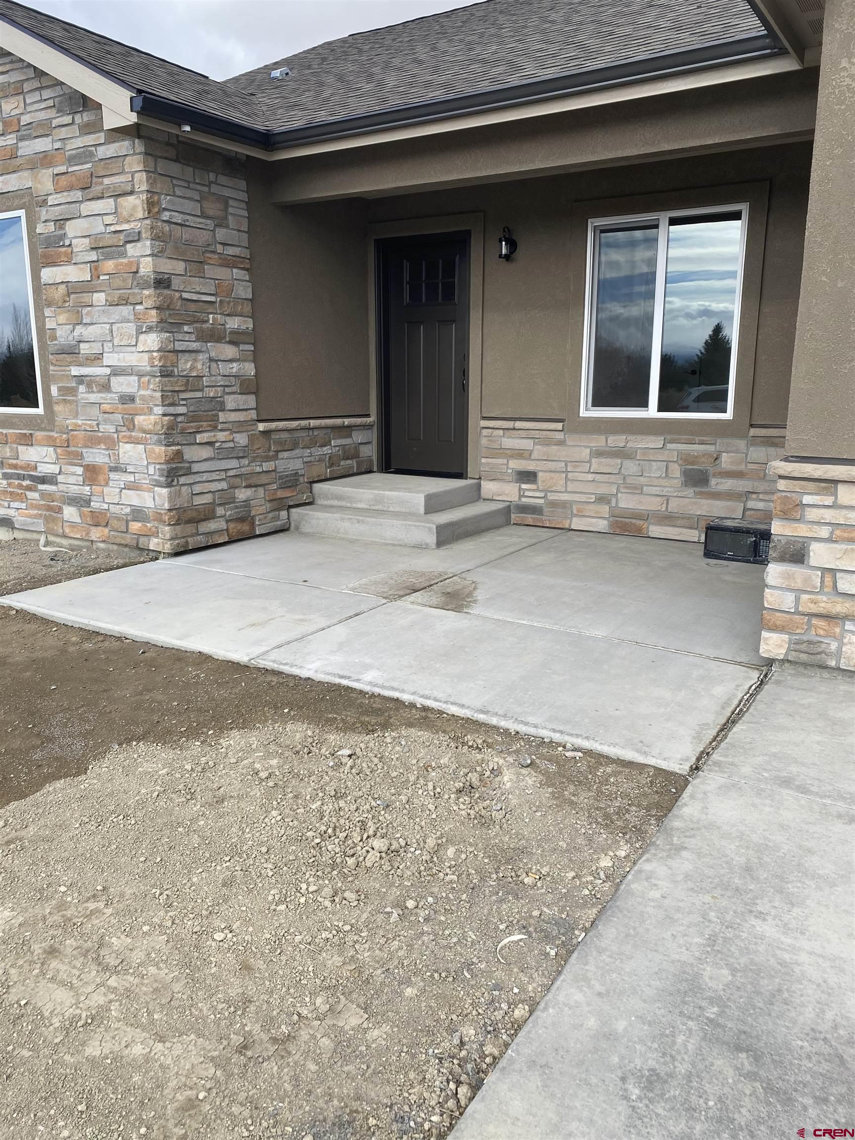 3672 Big Pines Loop Montrose, CO 81401 - Photo 3 of 19 a front view of a house