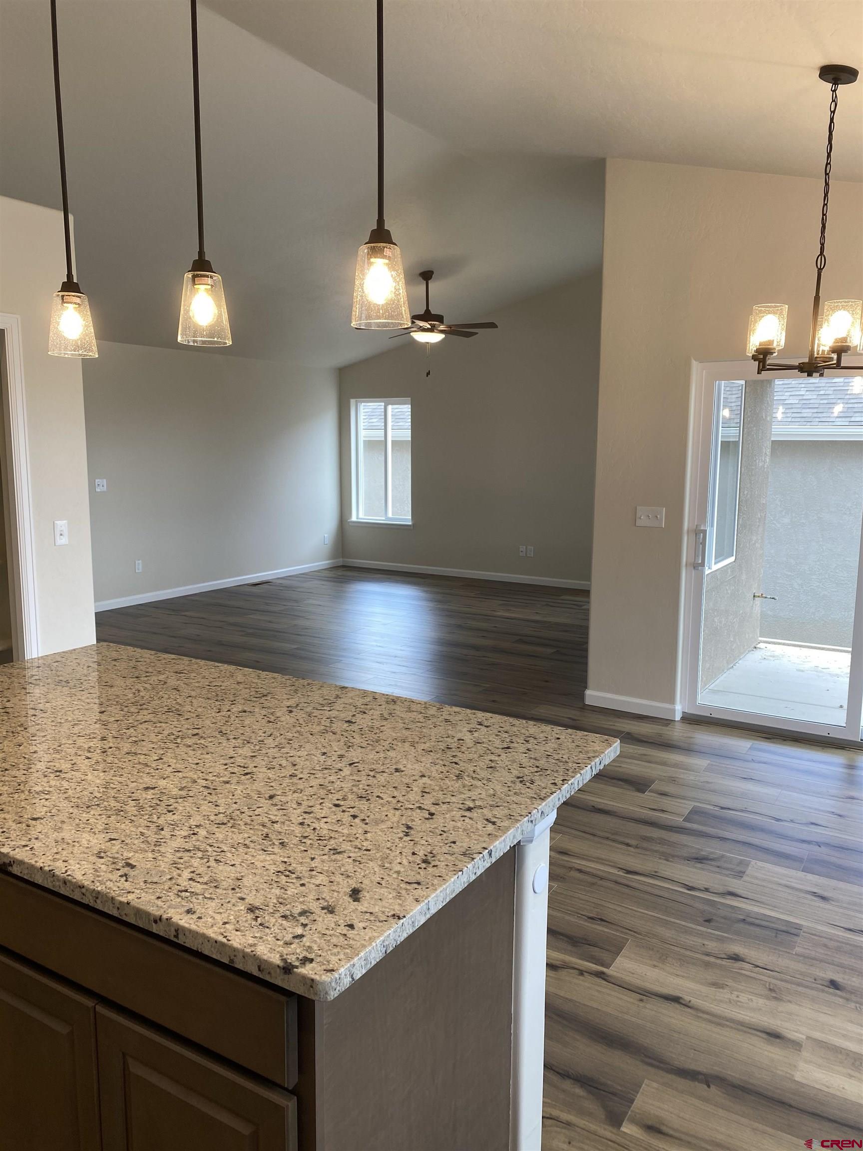 3672 Big Pines Loop Montrose, CO 81401 - Photo 4 of 19 a view of a kitchen and a sink chandelier