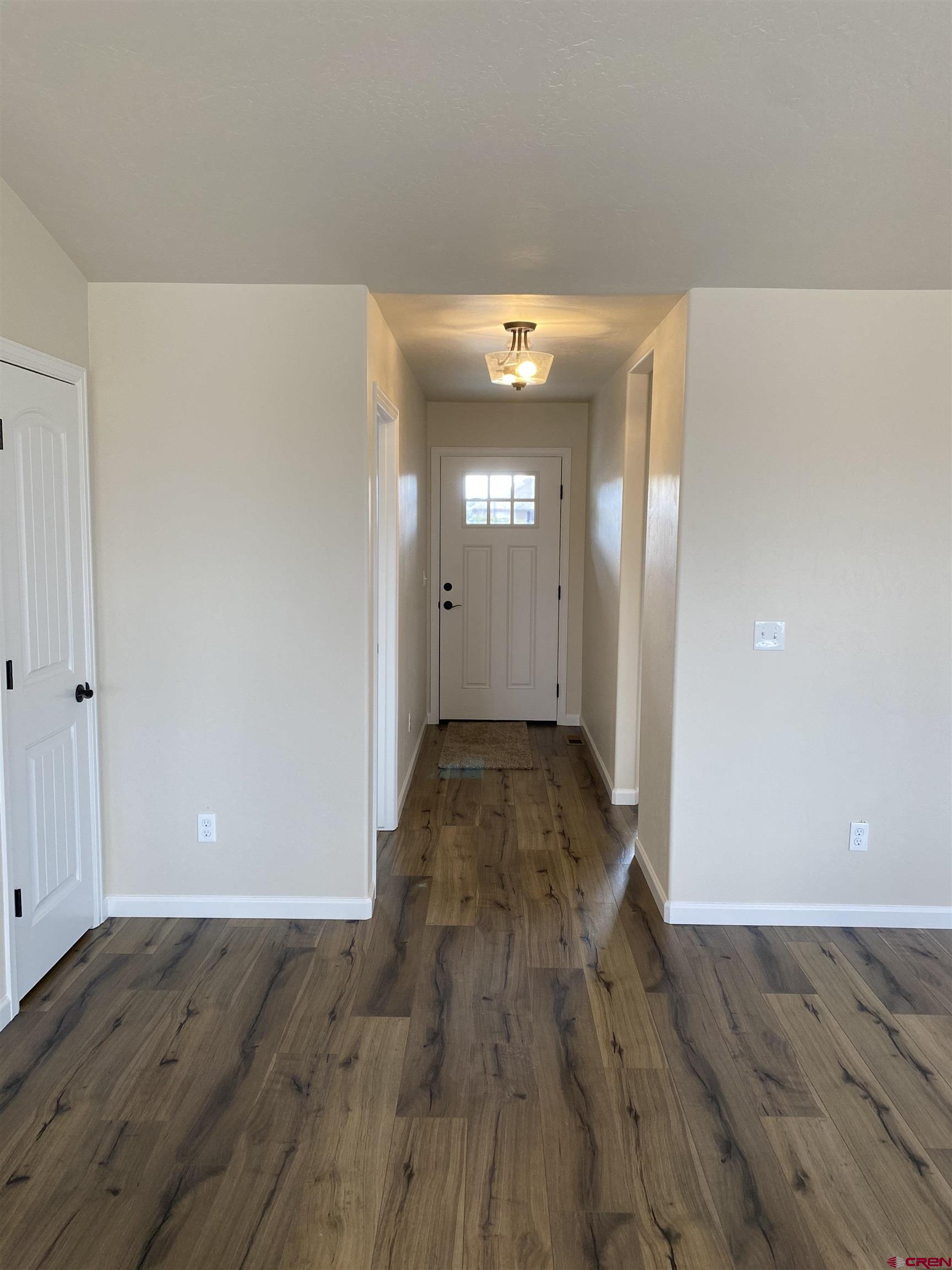 3672 Big Pines Loop Montrose, CO 81401 - Photo 7 of 19 a view of an empty room and wooden floor