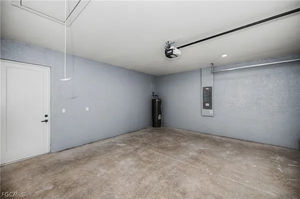 a view of an empty room with a ceiling fan