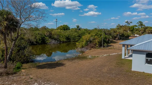 a view of a lake with a yard