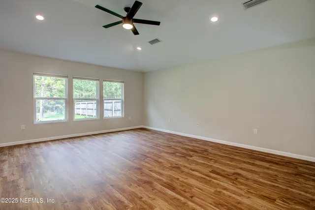 a kitchen with granite countertop a sink and a window