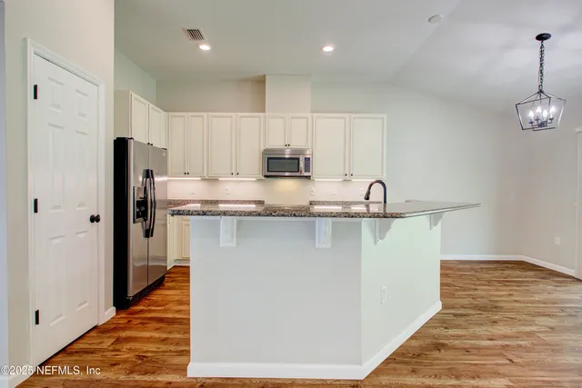 a bathroom with a bathtub and a sink