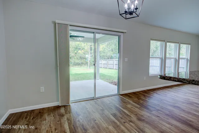 a view of room with window and ceiling fan