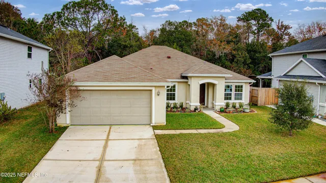 a front view of a house with garden