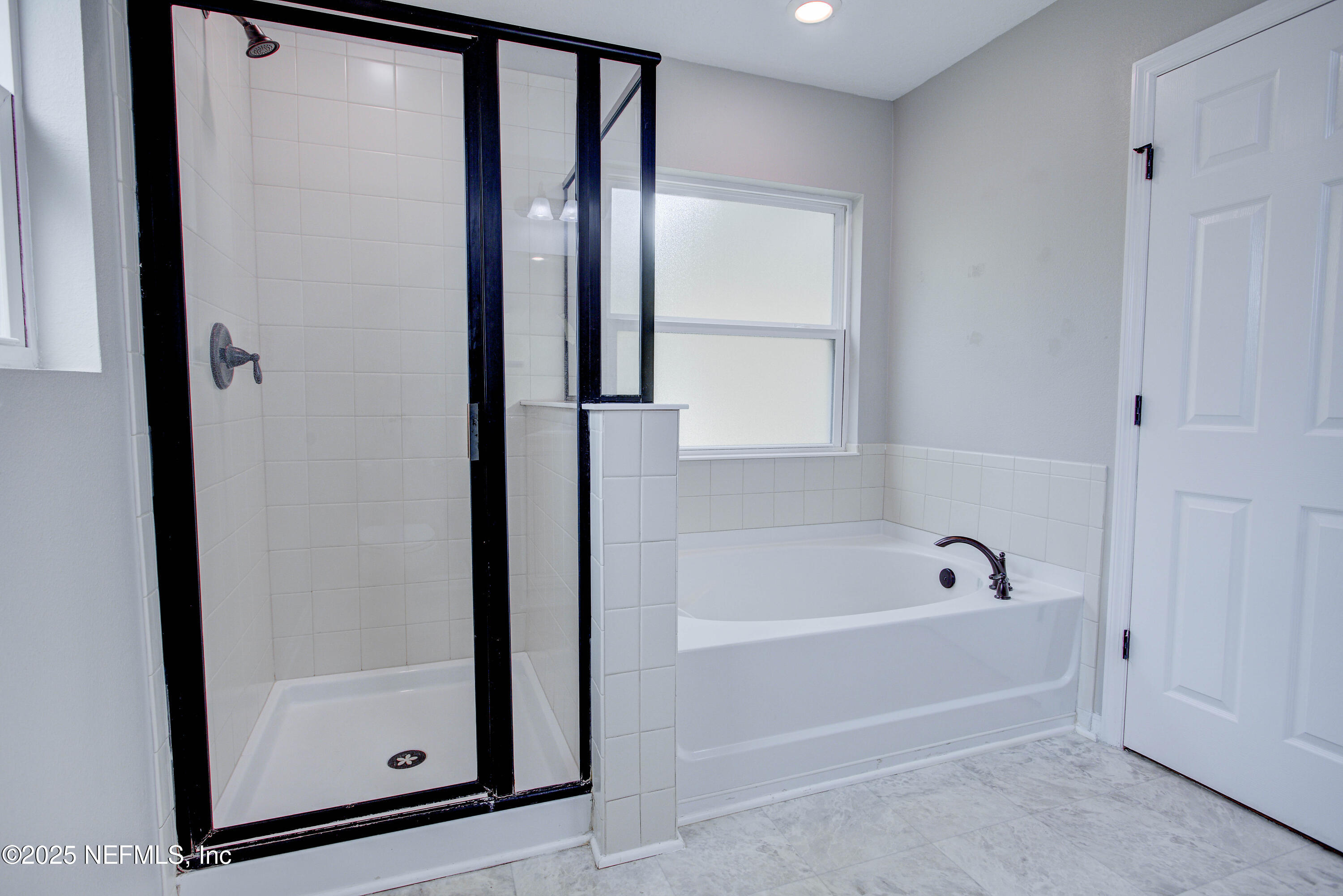 7341 Steventon Way Jacksonville, FL 32244 - Photo 41 of 75 a bathroom with a bathtub and a shower
