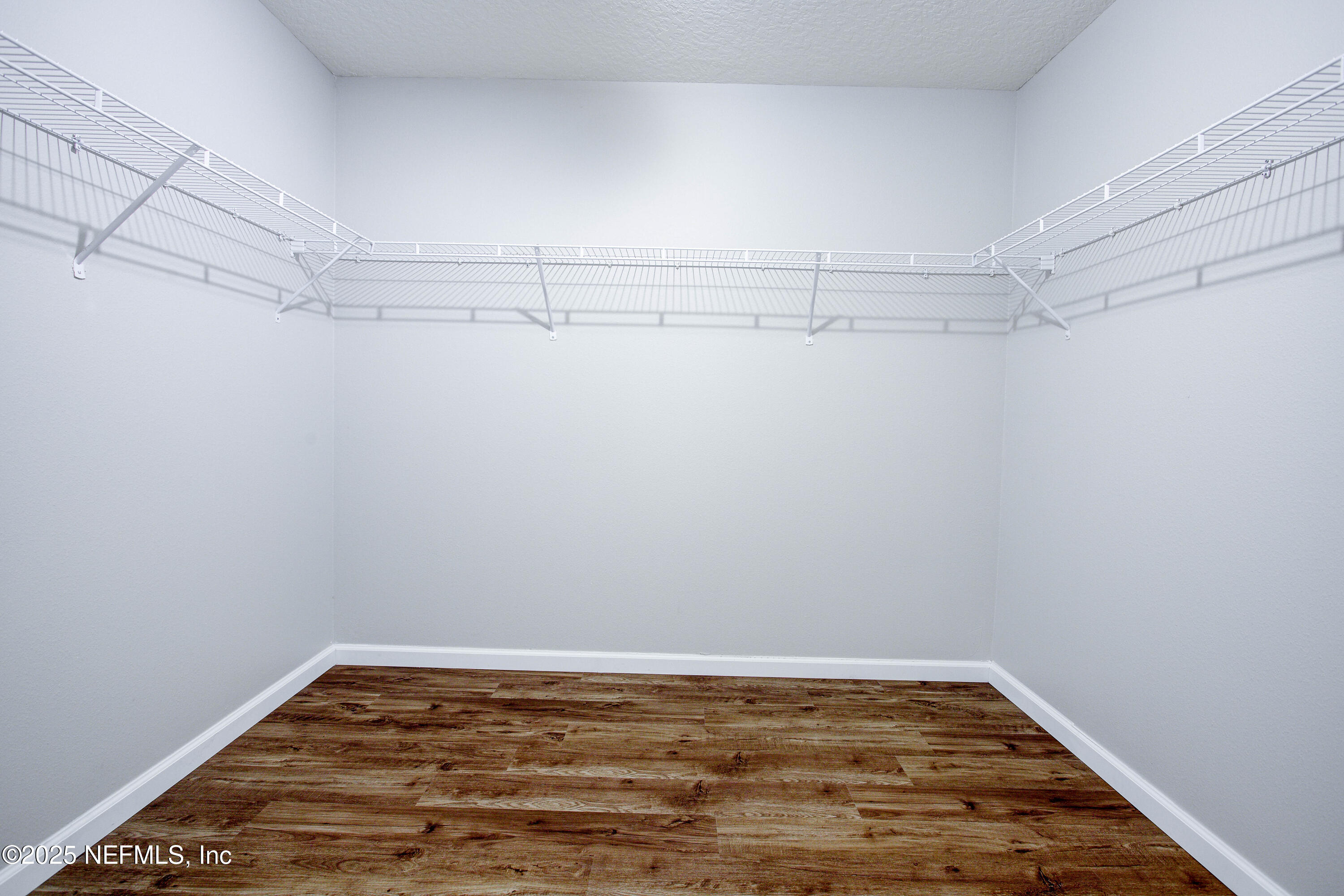 7341 Steventon Way Jacksonville, FL 32244 - Photo 43 of 75 a view of a room with racks on the wall