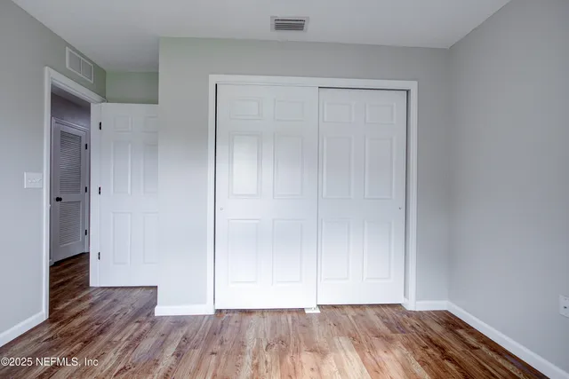 a view of a backyard with a small cabin