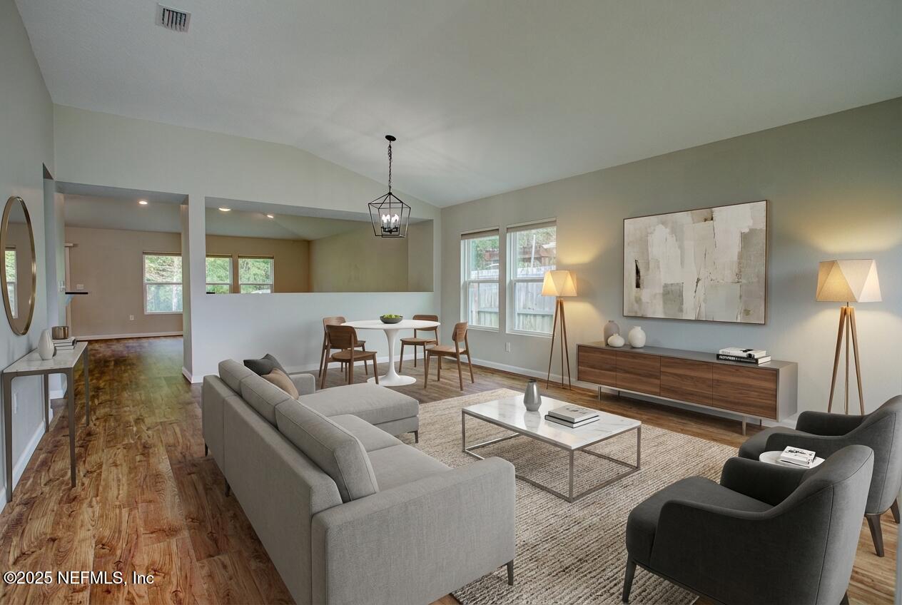 7341 Steventon Way Jacksonville, FL 32244 - Photo 9 of 75 a living room with furniture and a wooden floor