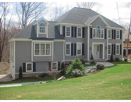 81 Higley Road Ashland, MA 01721 - Photo 1 of 16 a front view of a house with a yard