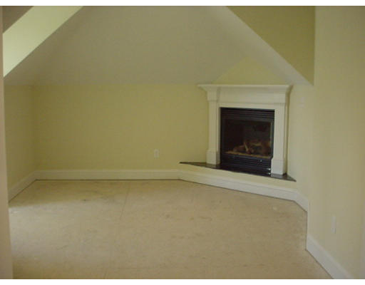 81 Higley Road Ashland, MA 01721 - Photo 13 of 16 a view of empty room with a fireplace