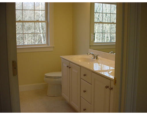 81 Higley Road Ashland, MA 01721 - Photo 15 of 16 a bathroom with a granite countertop toilet a sink and a window