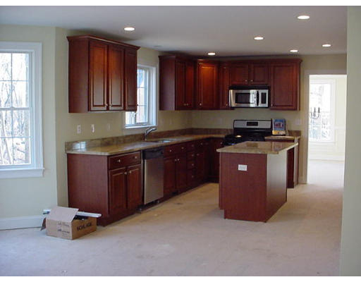 81 Higley Road Ashland, MA 01721 - Photo 2 of 16 a kitchen with stainless steel appliances granite countertop a stove a sink a refrigerator and cabinets