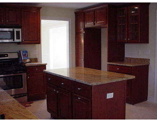 81 Higley Road Ashland, MA 01721 - Photo 3 of 16 a kitchen with a sink and cabinets