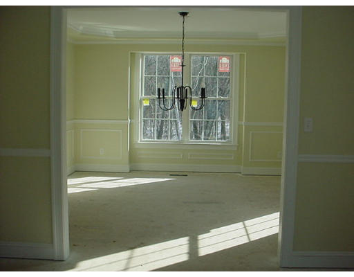 81 Higley Road Ashland, MA 01721 - Photo 8 of 16 a bathroom with a glass shower door
