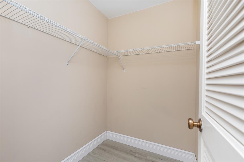 Undisclosed Address Boynton Beach, FL 33436 - Photo 11 of 16 a view of a room with racks on the wall