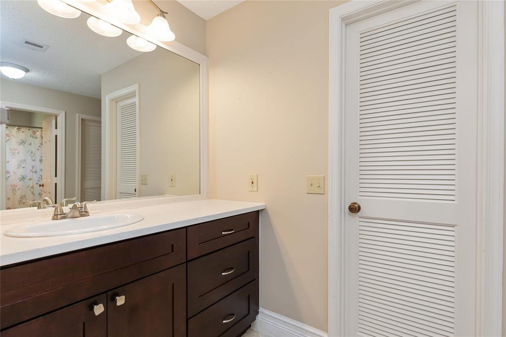 Undisclosed Address Boynton Beach, FL 33436 - Photo 12 of 16 a bathroom with a sink and a mirror