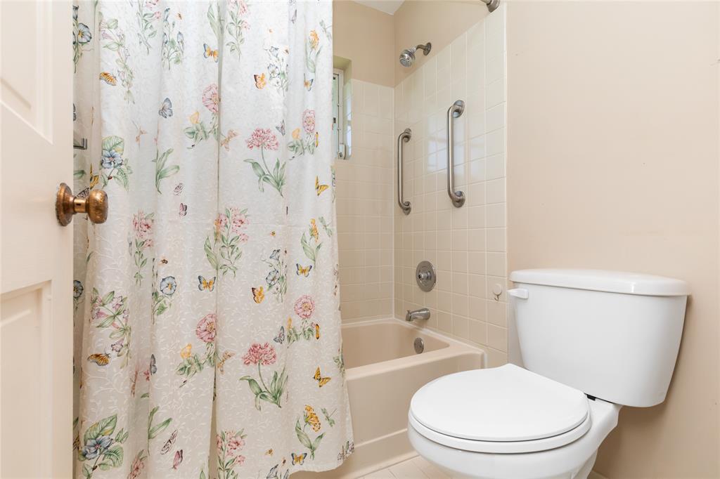 Undisclosed Address Boynton Beach, FL 33436 - Photo 13 of 16 a white toilet sitting next to a bath tub