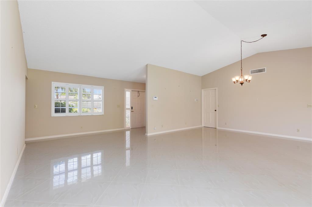 Undisclosed Address Boynton Beach, FL 33436 - Photo 8 of 16 an empty room with windows and fan