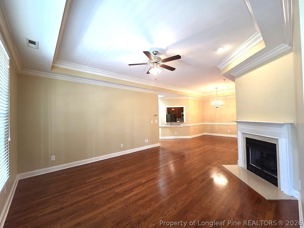 2671 Lockwood Road, Unit 202 Fayetteville, NC 28303 - Photo 11 of 32 wooden floor in an empty room with a fireplace