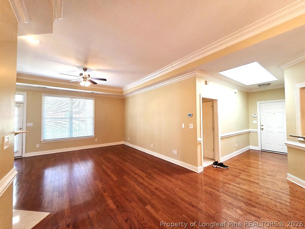 2671 Lockwood Road, Unit 202 Fayetteville, NC 28303 - Photo 13 of 32 a view of an empty room with wooden floor and a window
