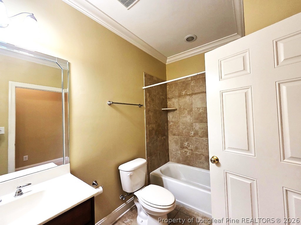 2671 Lockwood Road, Unit 202 Fayetteville, NC 28303 - Photo 15 of 32 a bathroom with a sink a toilet and shower