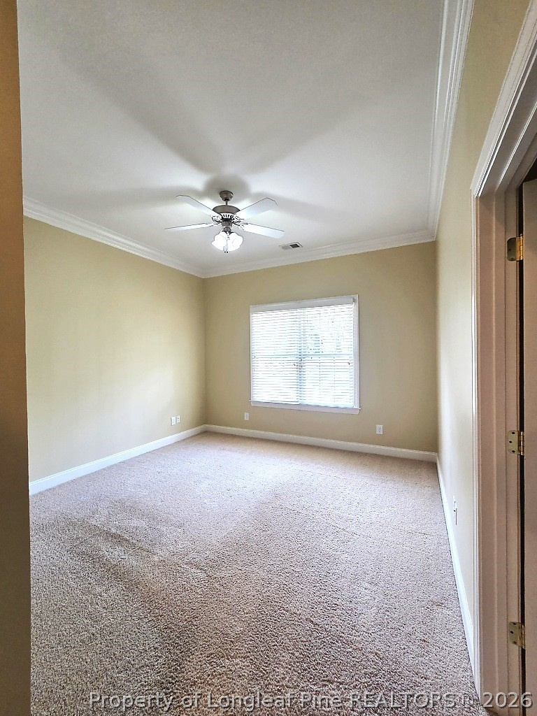 2671 Lockwood Road, Unit 202 Fayetteville, NC 28303 - Photo 19 of 32 an empty room with windows and chandelier fan